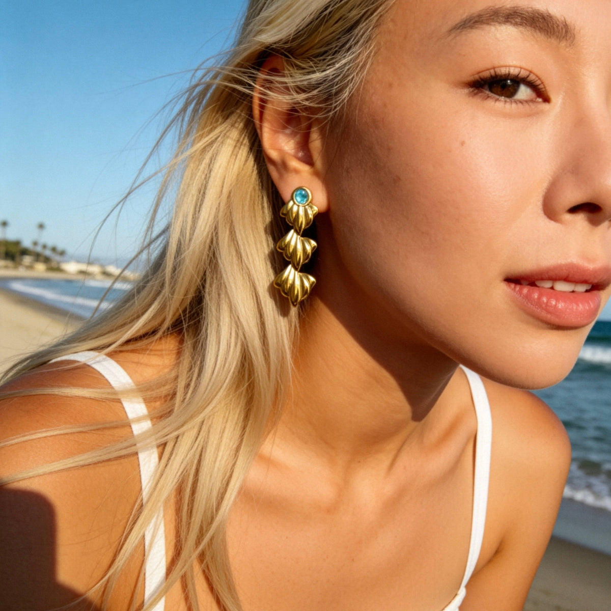 Gold Ocean Leaf Earrings with Blue Crystal