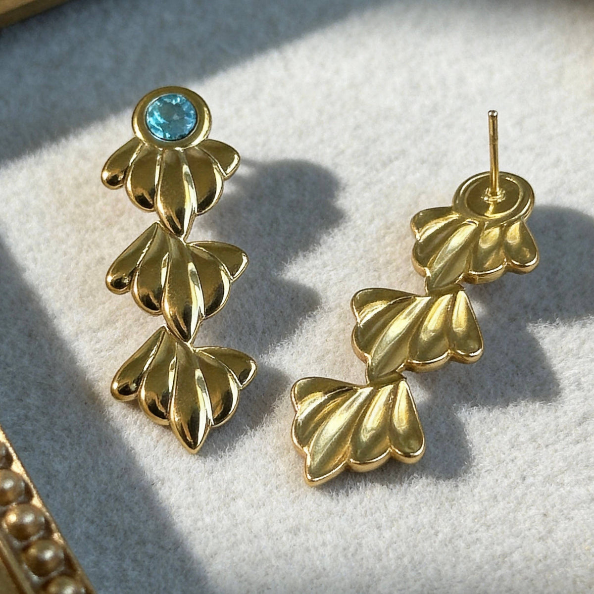 Gold Ocean Leaf Earrings with Blue Crystal
